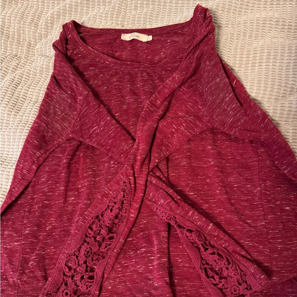 Long sleeve burgundy top with lace sleeves.